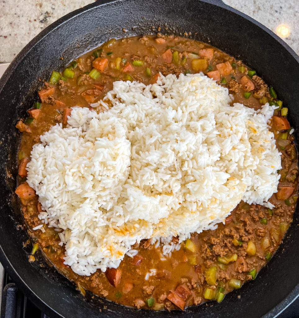 Cajun dirty rice in a cast iron skillet