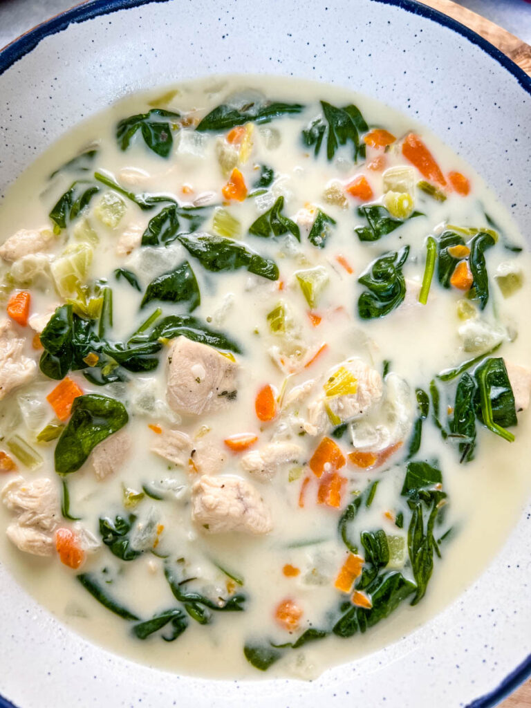 chicken florentine soup and spinach in a soup pot