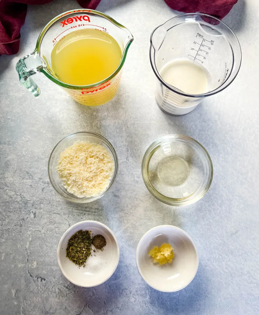 broth, white wine, parmesan cheese, heavy cream, Italian seasoning, and garlic in separate bowls