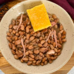 slow cooker Crockpot pinto beans and cornbread in a bowl