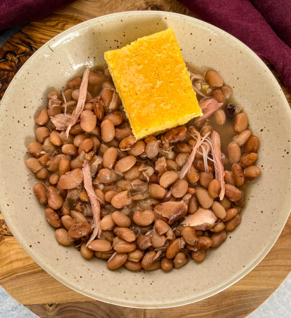 slow cooker Crockpot pinto beans and cornbread in a bowl