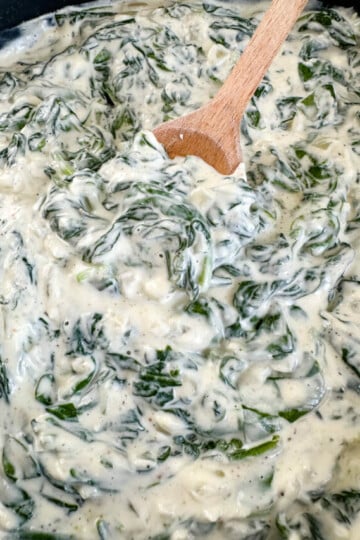 steakhouse creamed spinach in a cast iron skillet