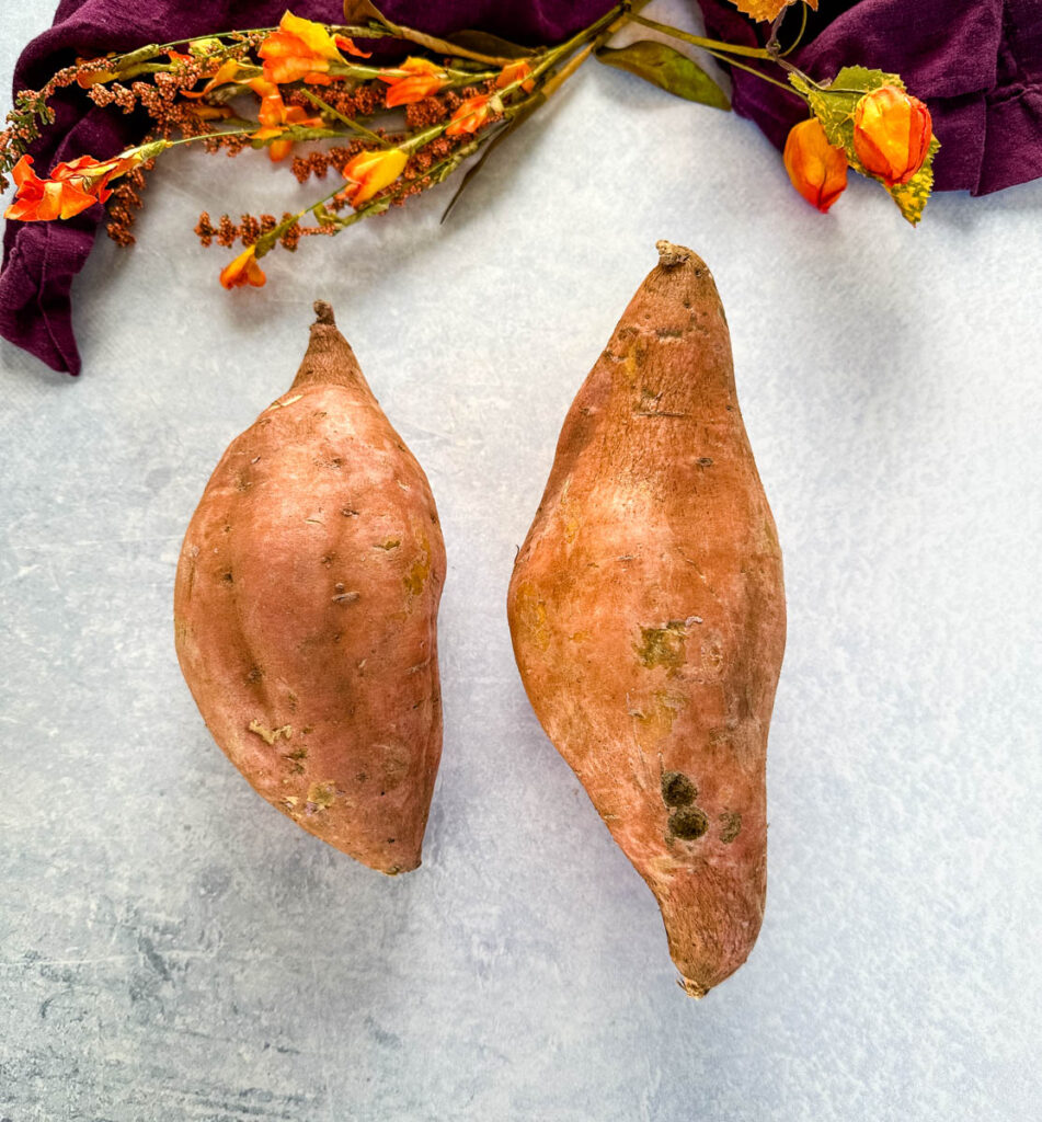 raw sweet potatoes on a flat surface