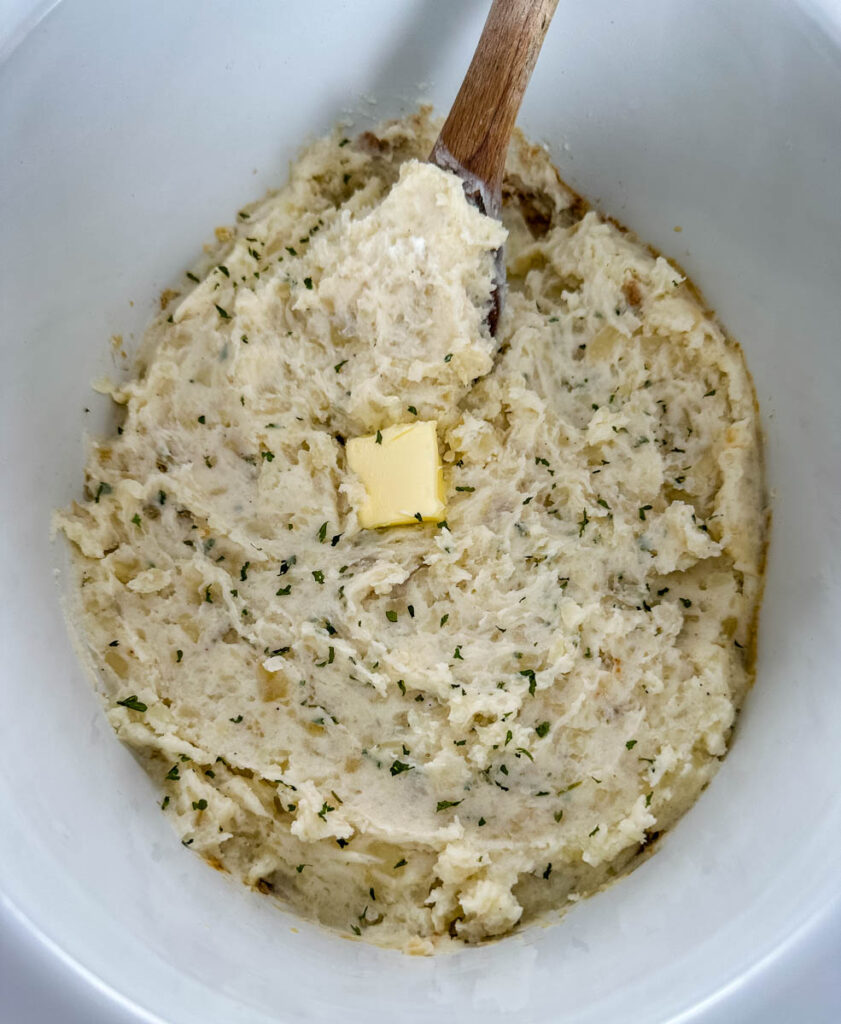 mashed potatoes in a Crockpot slow cooker with butter