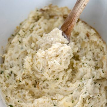 mashed potatoes in a Crockpot slow cooker with butter