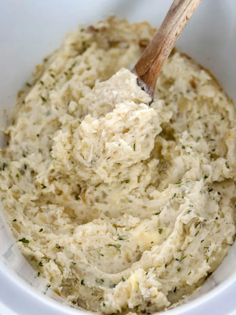 mashed potatoes in a Crockpot slow cooker with butter