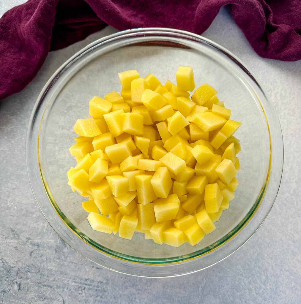 diced gold potatoes in a glass bowl