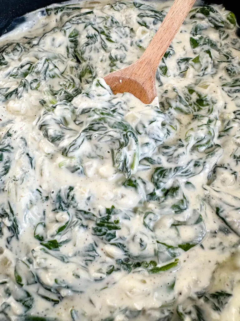 steakhouse creamed spinach in a cast iron skillet