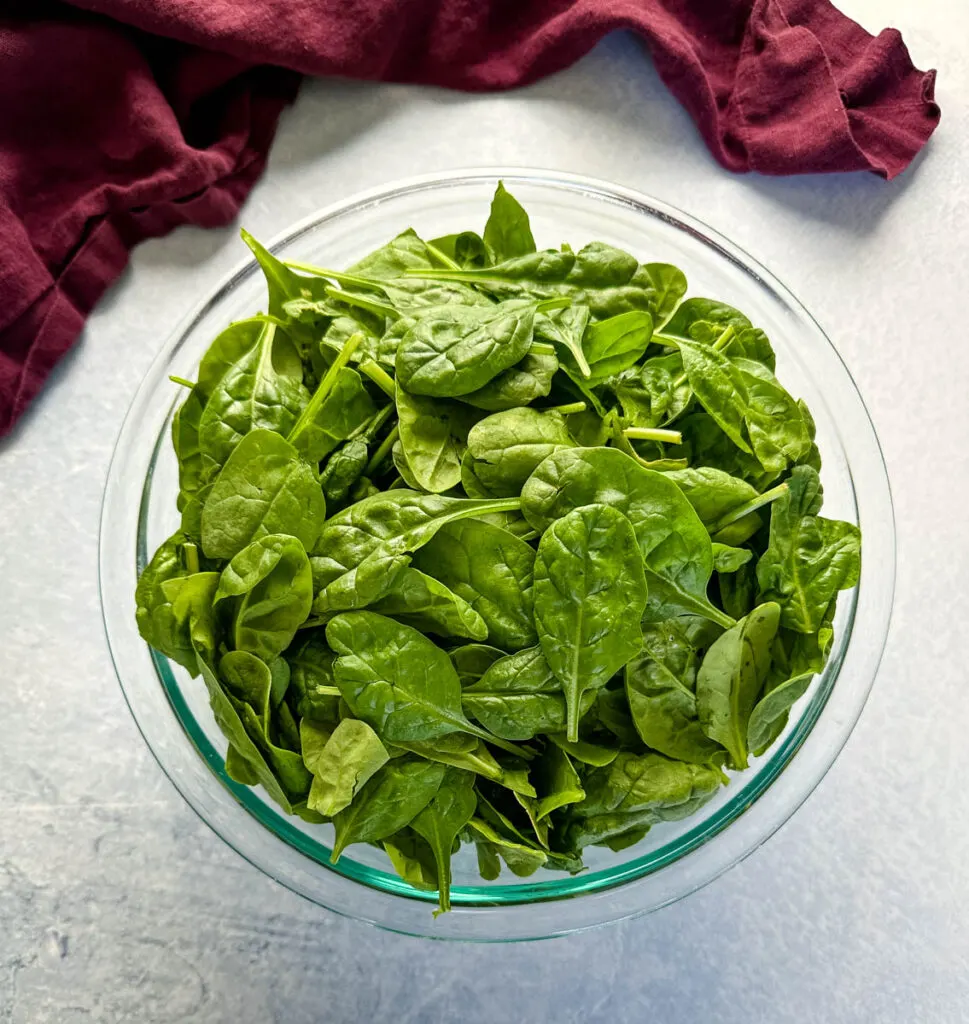 fresh spinach in a glass bowl