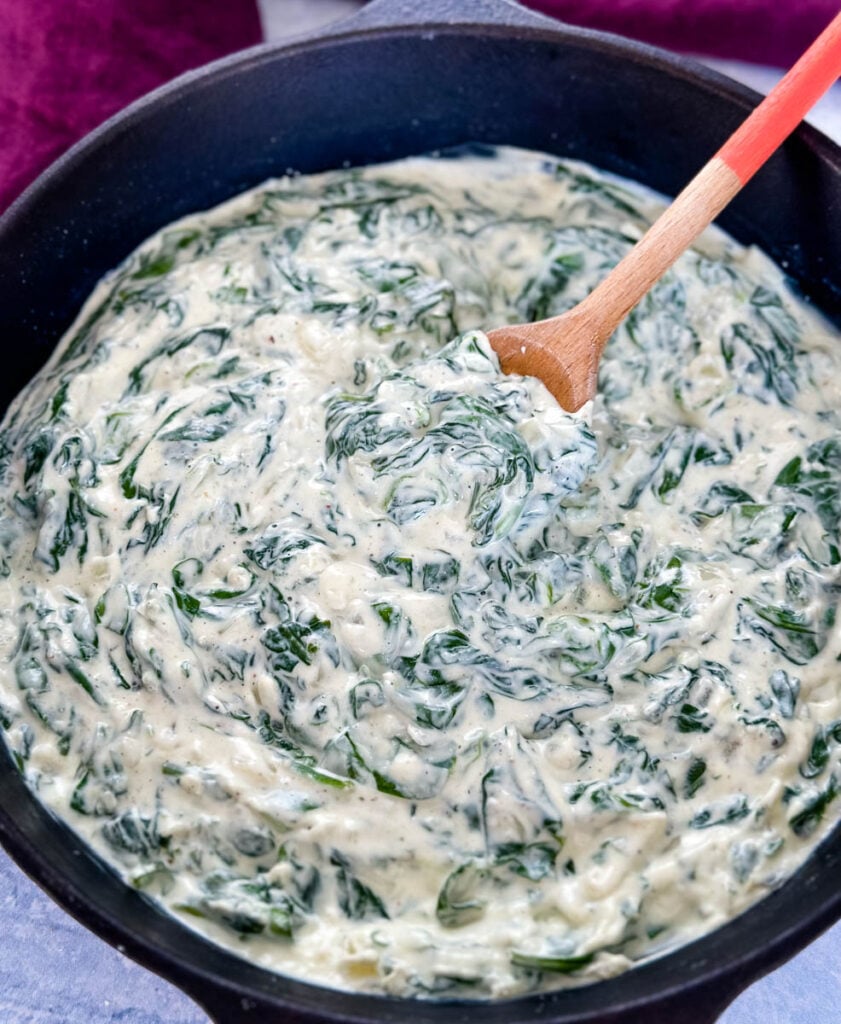 steakhouse creamed spinach in a cast iron skillet