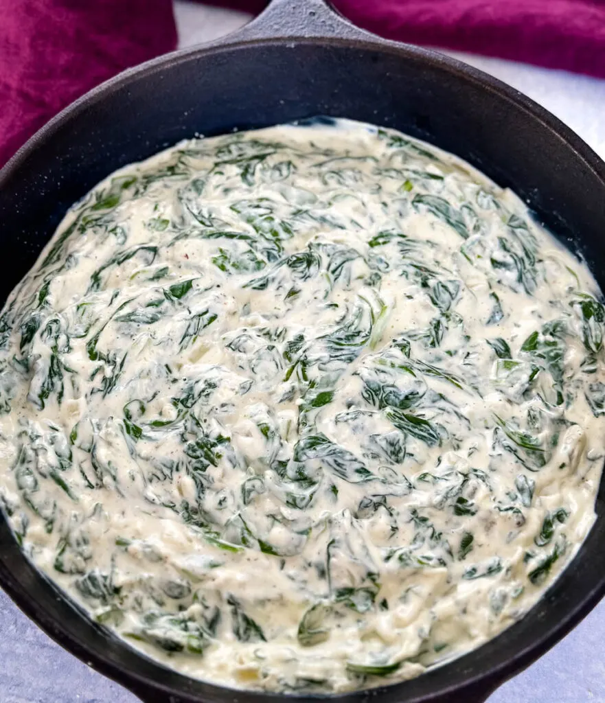steakhouse creamed spinach in a cast iron skillet