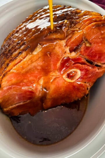 ham in a slow cooker Crockpot glazed with honey and brown sugar