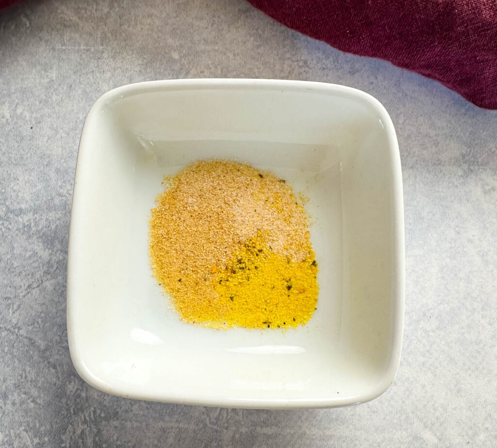 lemon pepper, garlic powder, and onion powder in a white bowl