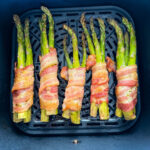 cooked bacon wrapped asparagus in an air fryer