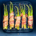 cooked bacon wrapped asparagus in an air fryer