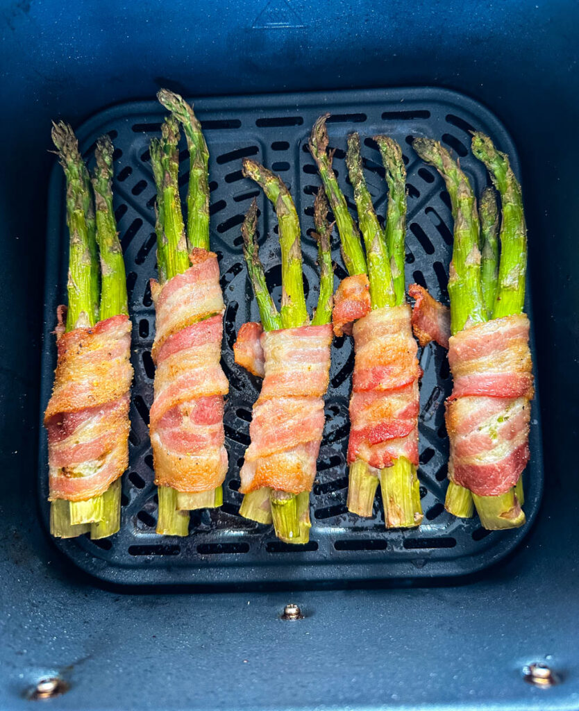 cooked bacon wrapped asparagus in an air fryer