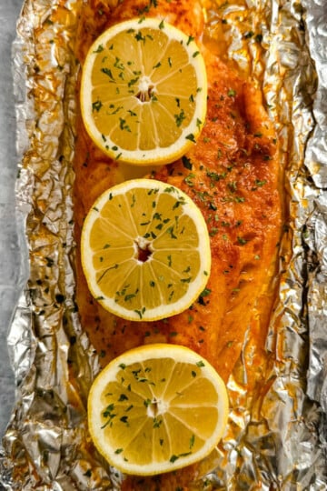 grilled cod with lemon on a plate