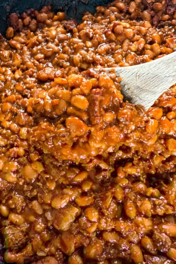 wooden spoonful of smoked baked beans
