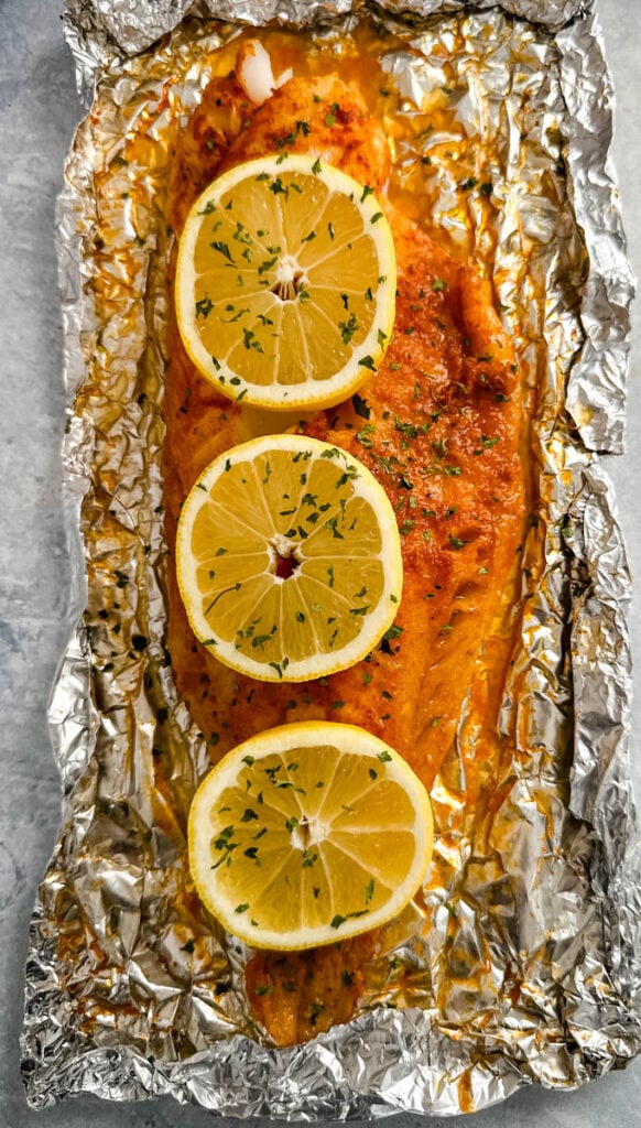 grilled cod with lemon on a plate