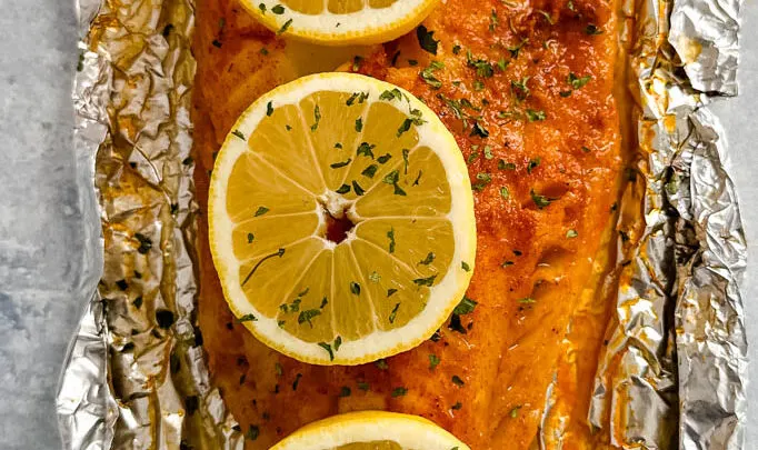 grilled cod with lemon on a plate