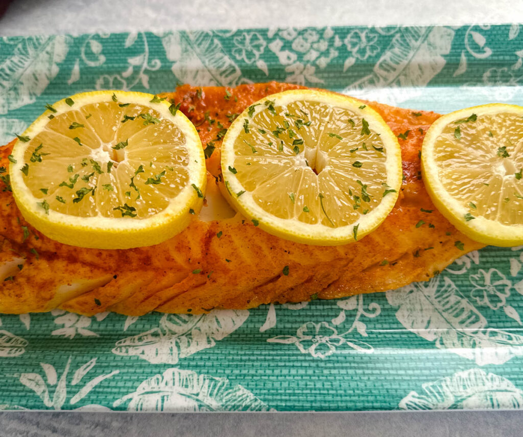 grilled cod with lemon on a plate