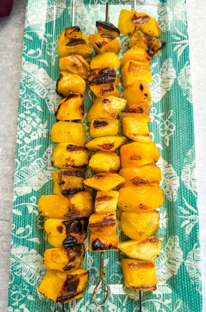 grilled mango on a blue plate