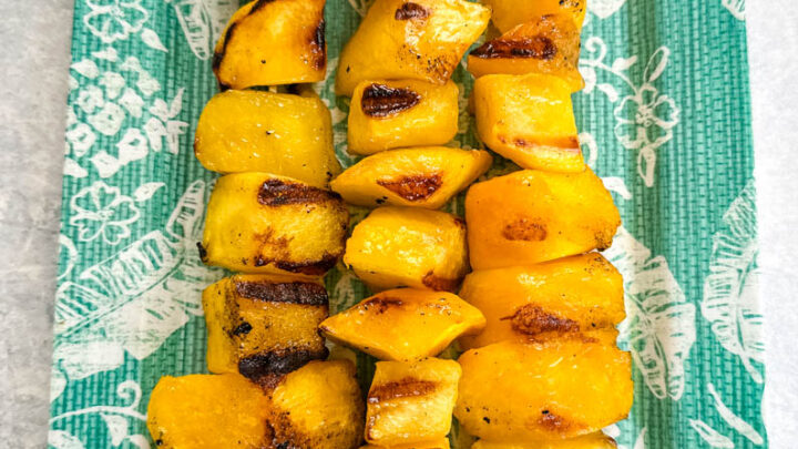 grilled mango on a blue plate