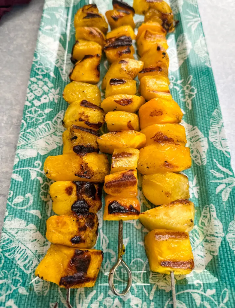 grilled mango on a blue plate