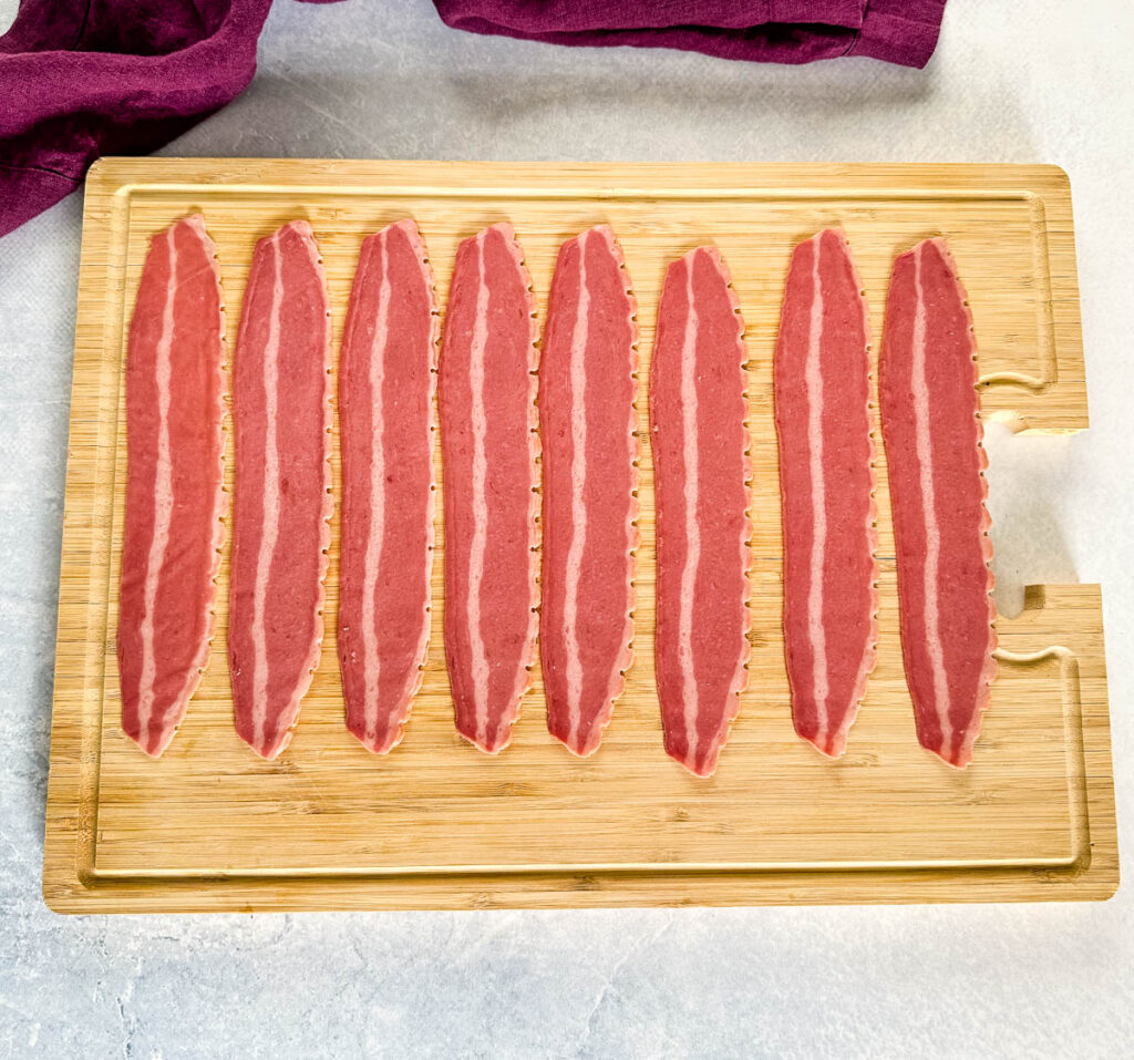uncooked turkey bacon on a cutting board