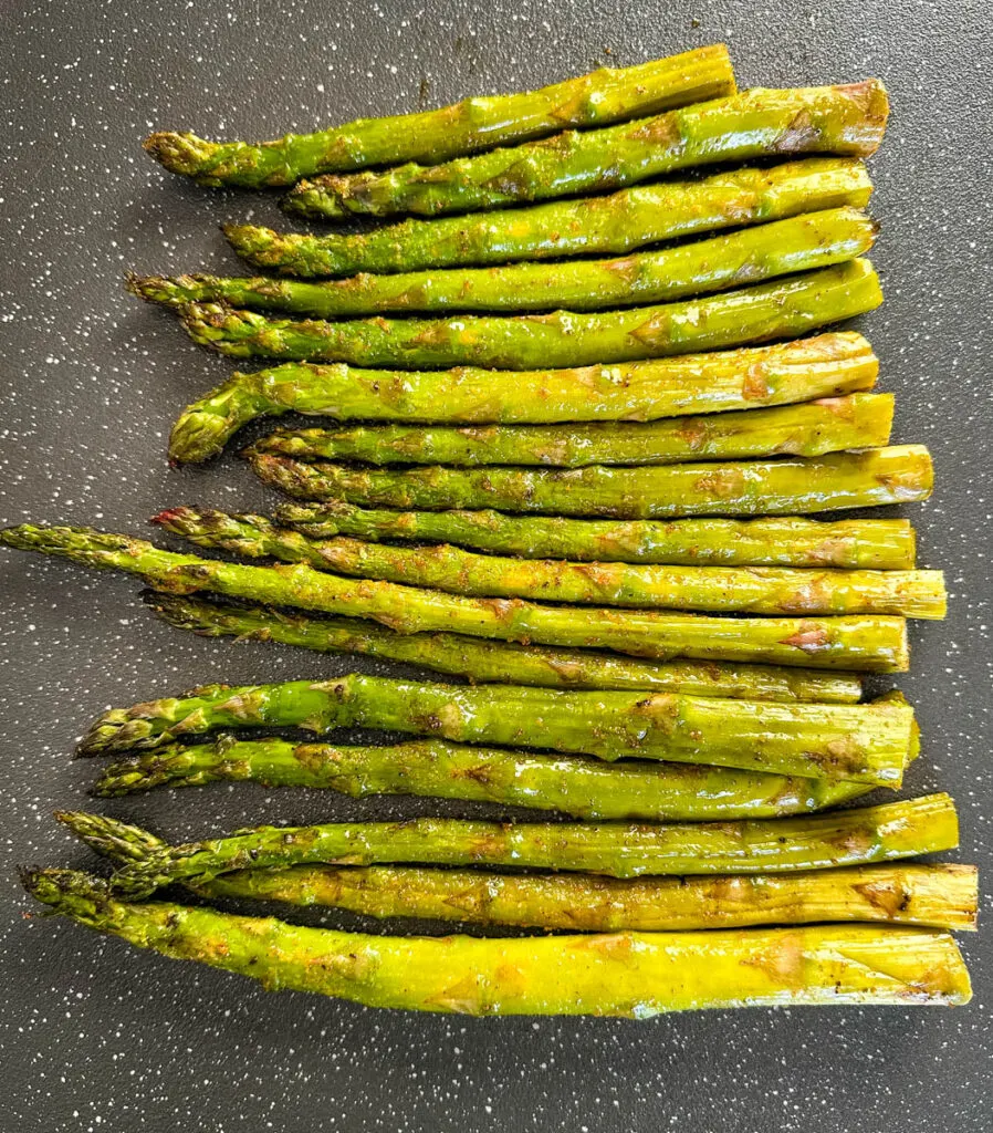 fresh asparagus with spices on a plate