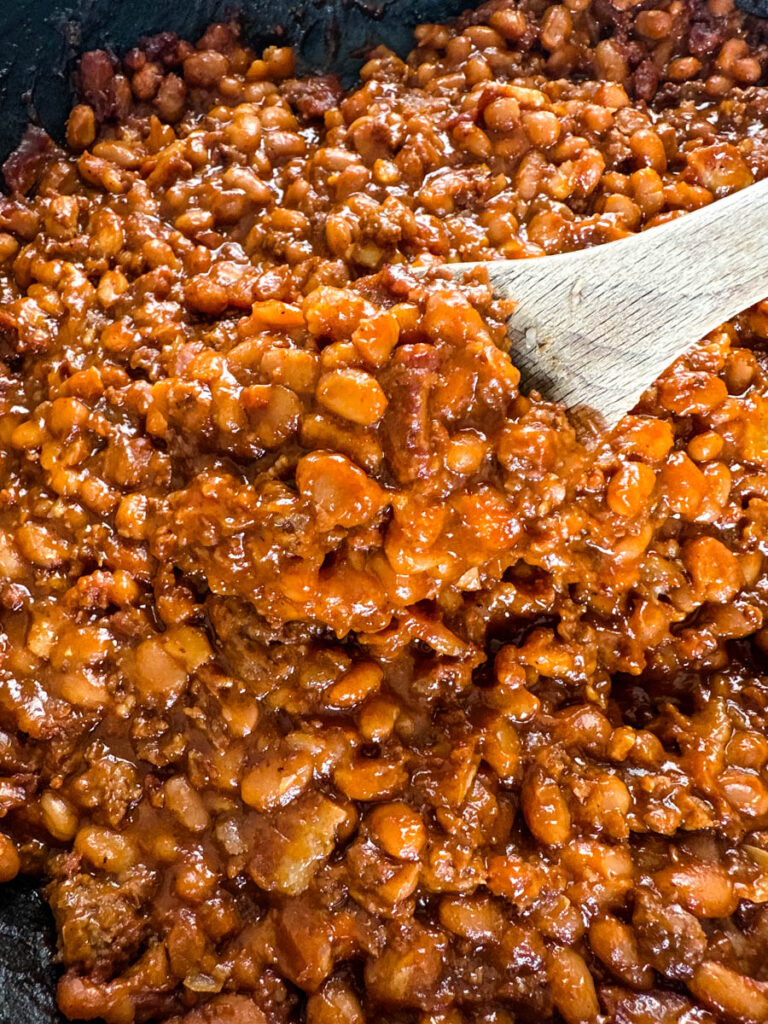 wooden spoonful of smoked baked beans