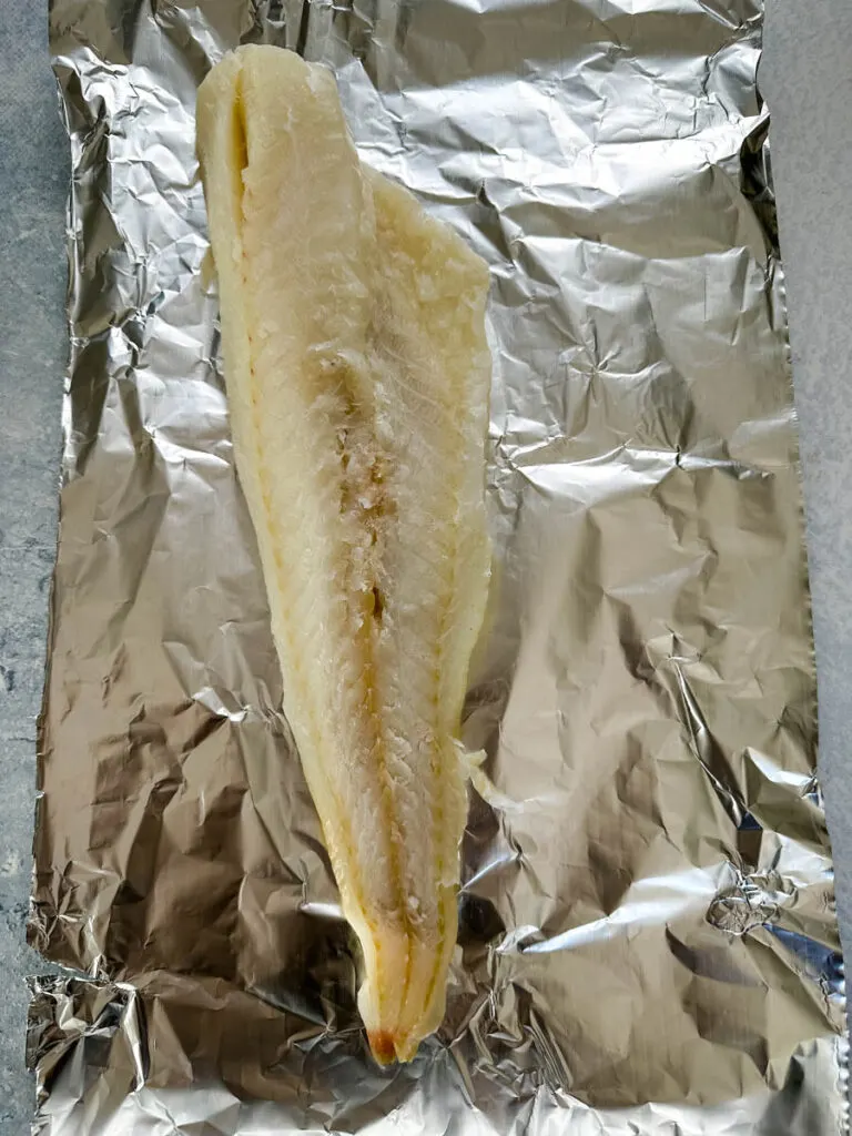 white cod fish on foil