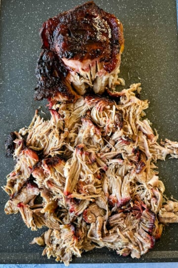 smoked pulled pork and pork shoulder on a sheet pan