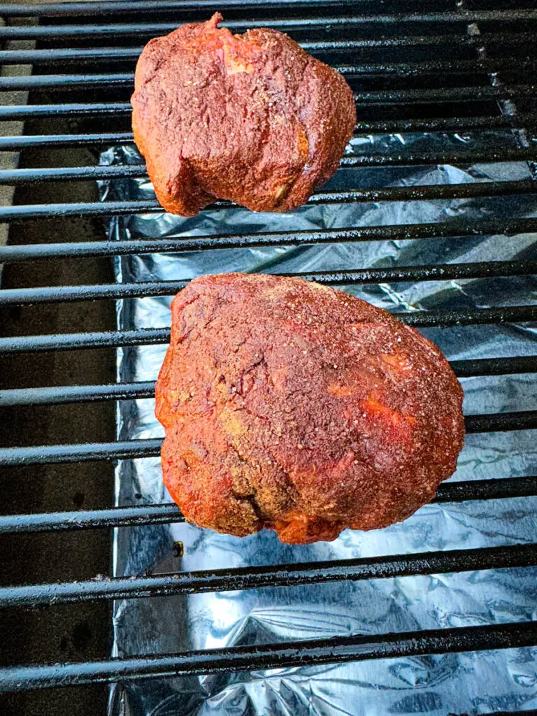 raw filet mignon steaks on a Traeger grill