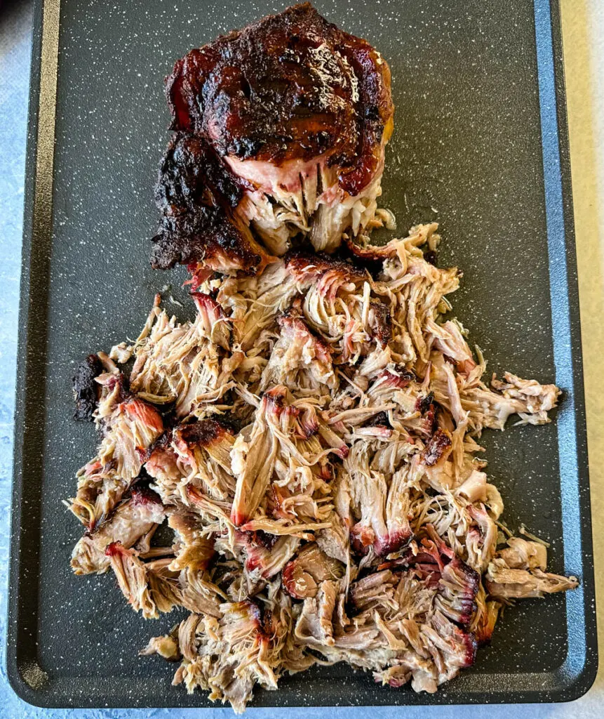 smoked pulled pork and pork shoulder on a sheet pan
