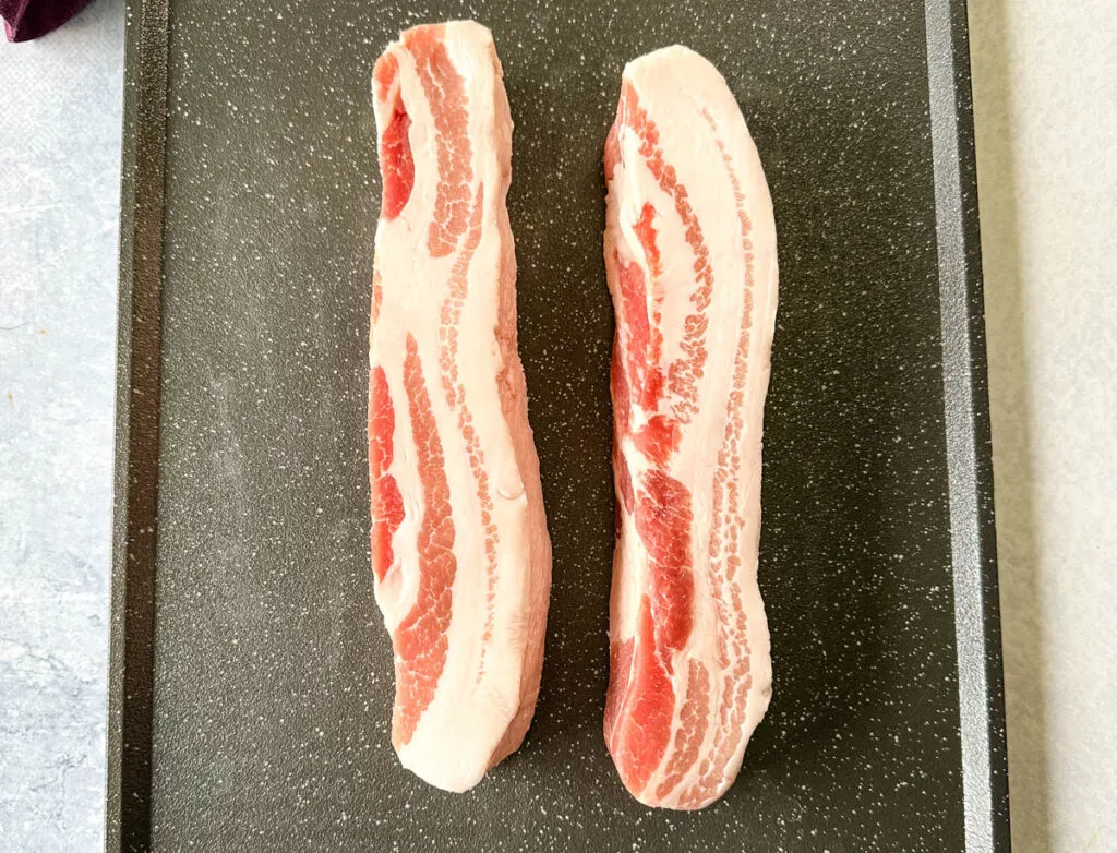 raw pork belly on a flat surface