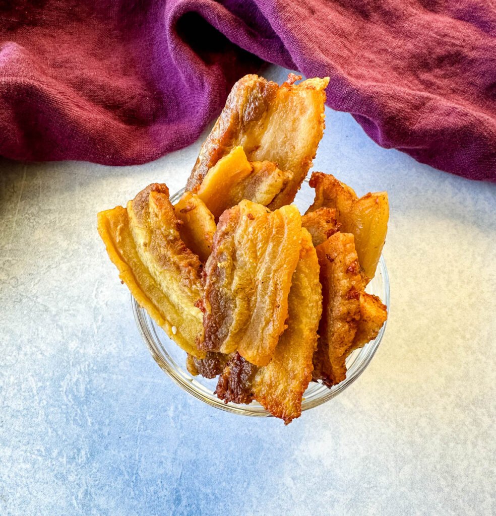 crispy pork belly in a glass bowl