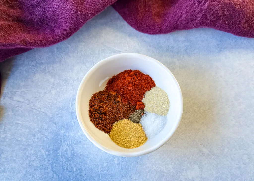 chicken dry rub spices in a white bowl