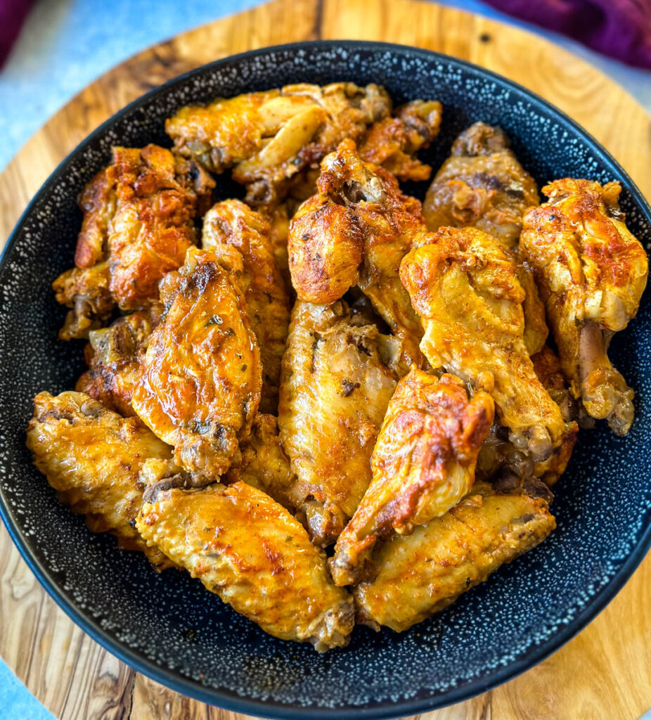 Crockpot chicken wings in a black bowl