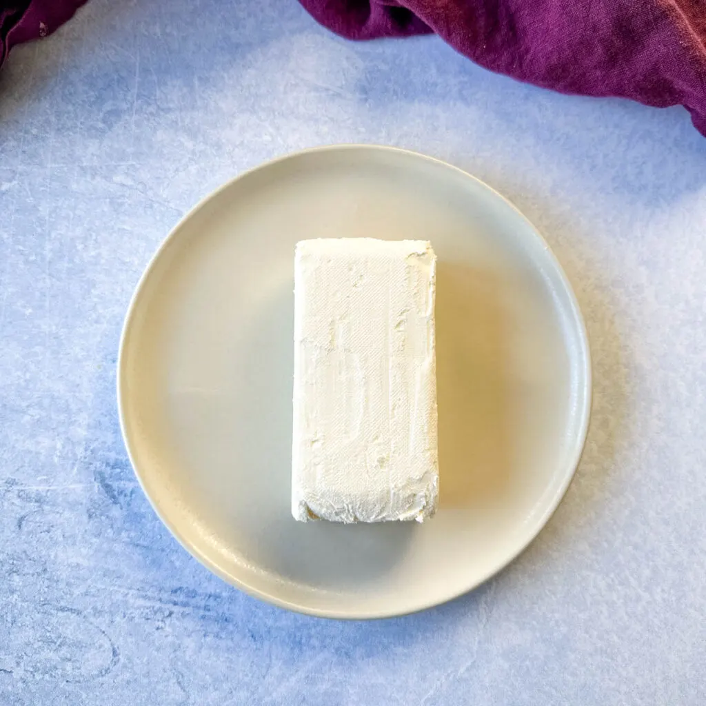 8oz block of cream cheese on a plate