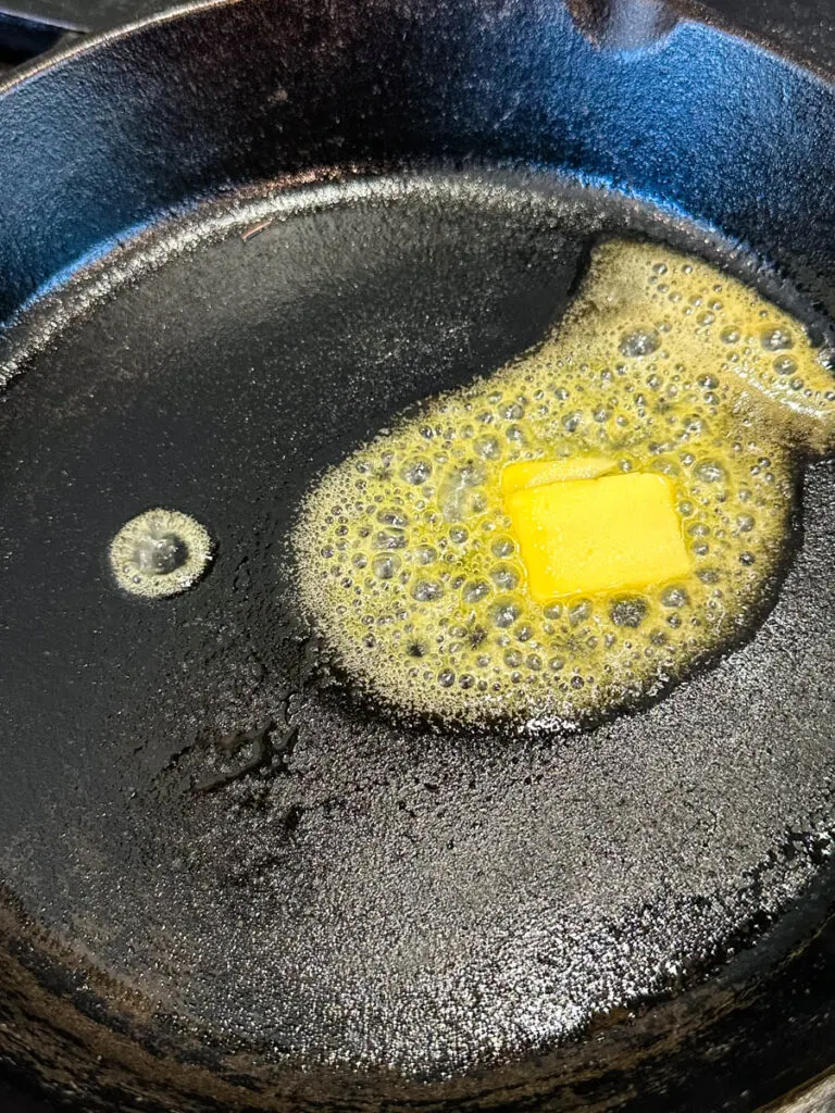 melted butter in a cast iron skillet