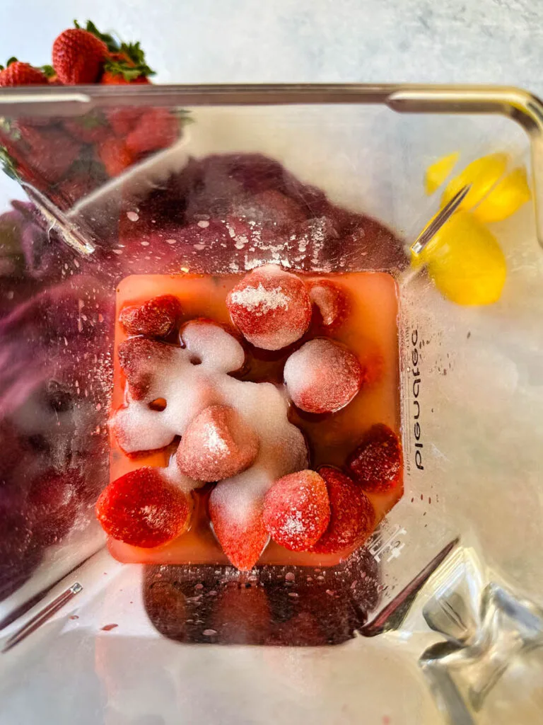 frozen strawberries, sweetener, lemon juice, and ice in a blender