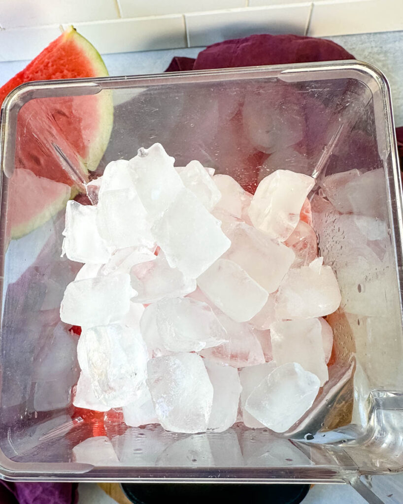 frozen watermelon margaritas in a blender with ice