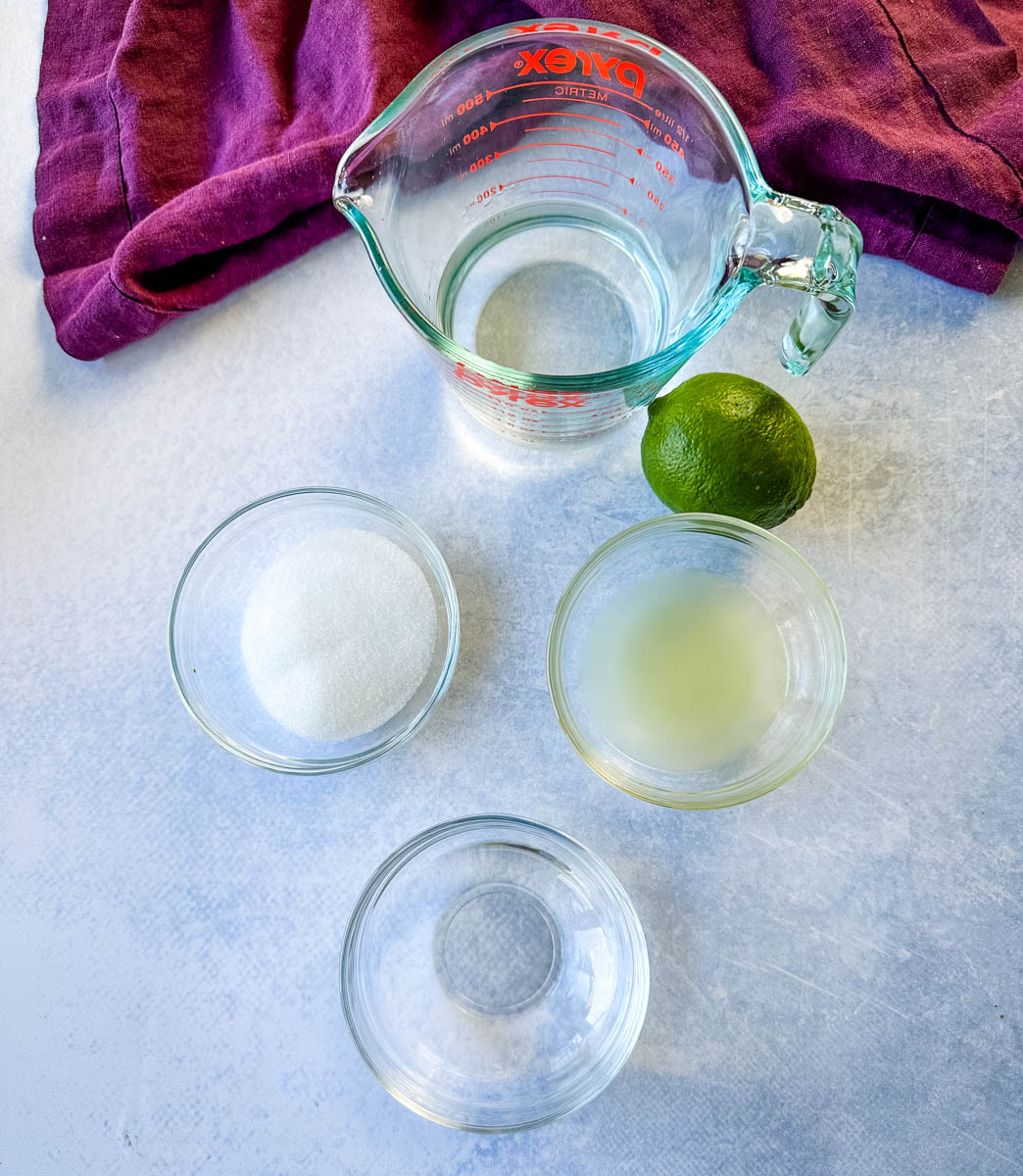 water, sweetener or sugar, fresh lime juice, and tequila in separate glass bowls