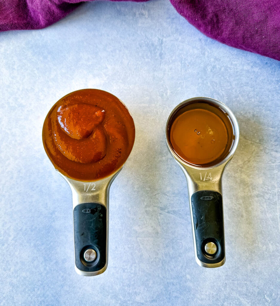 honey and BBQ sauce in separate measuring cups