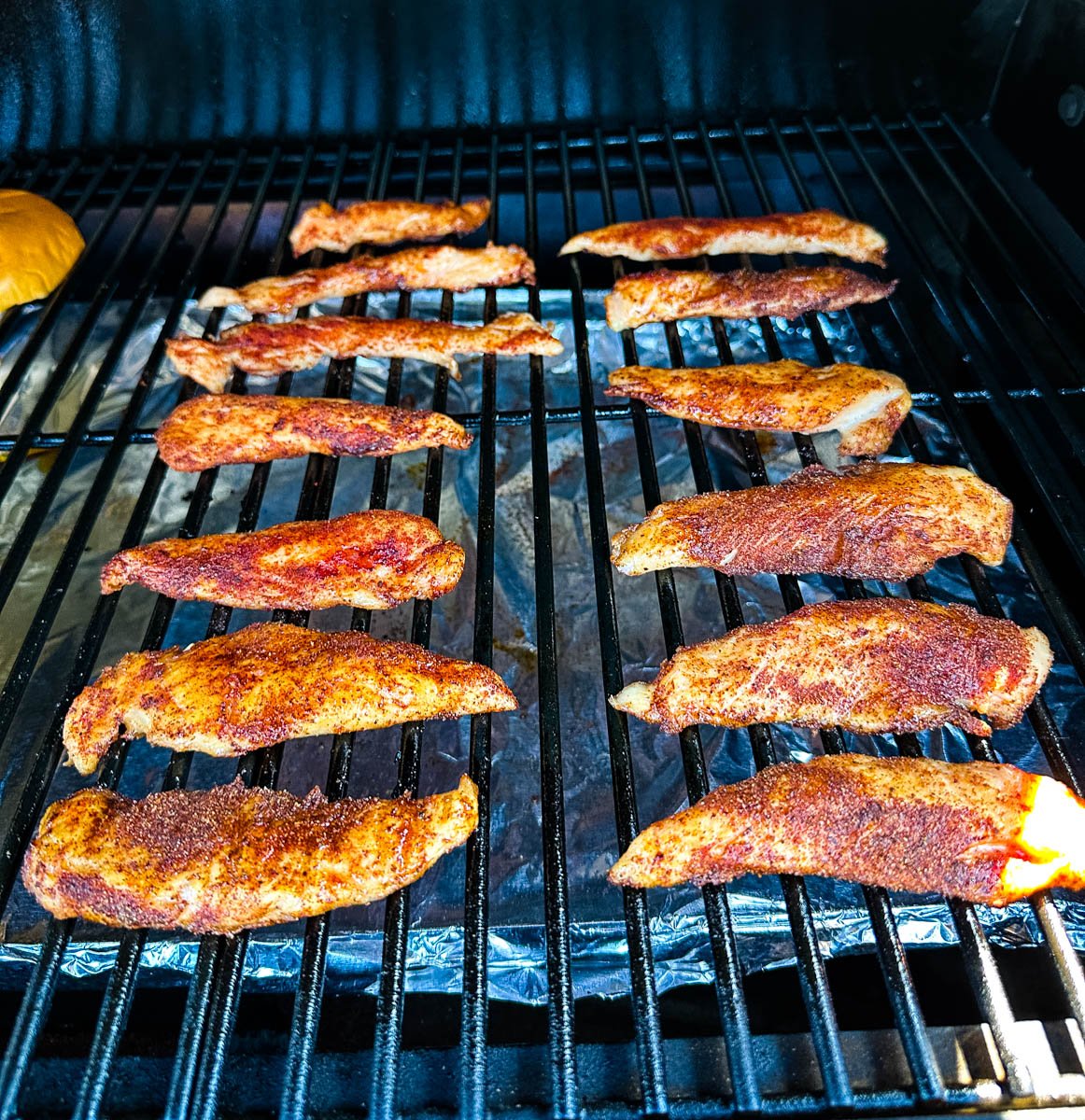 smoked chicken tenders on a Traeger smoker grill