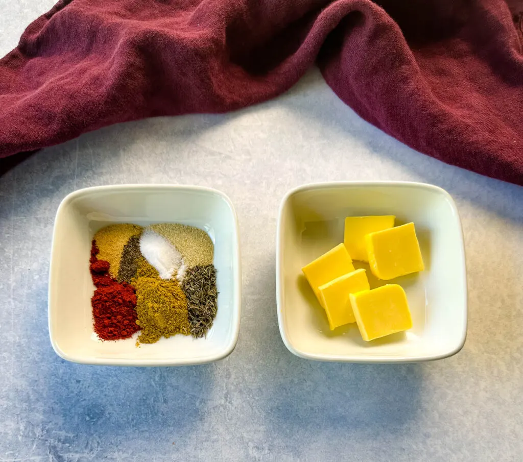 butter and spices in separate white bowls