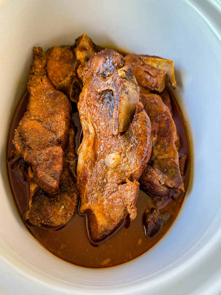 country style ribs with BBQ sauce in a slow cooker Crockpot