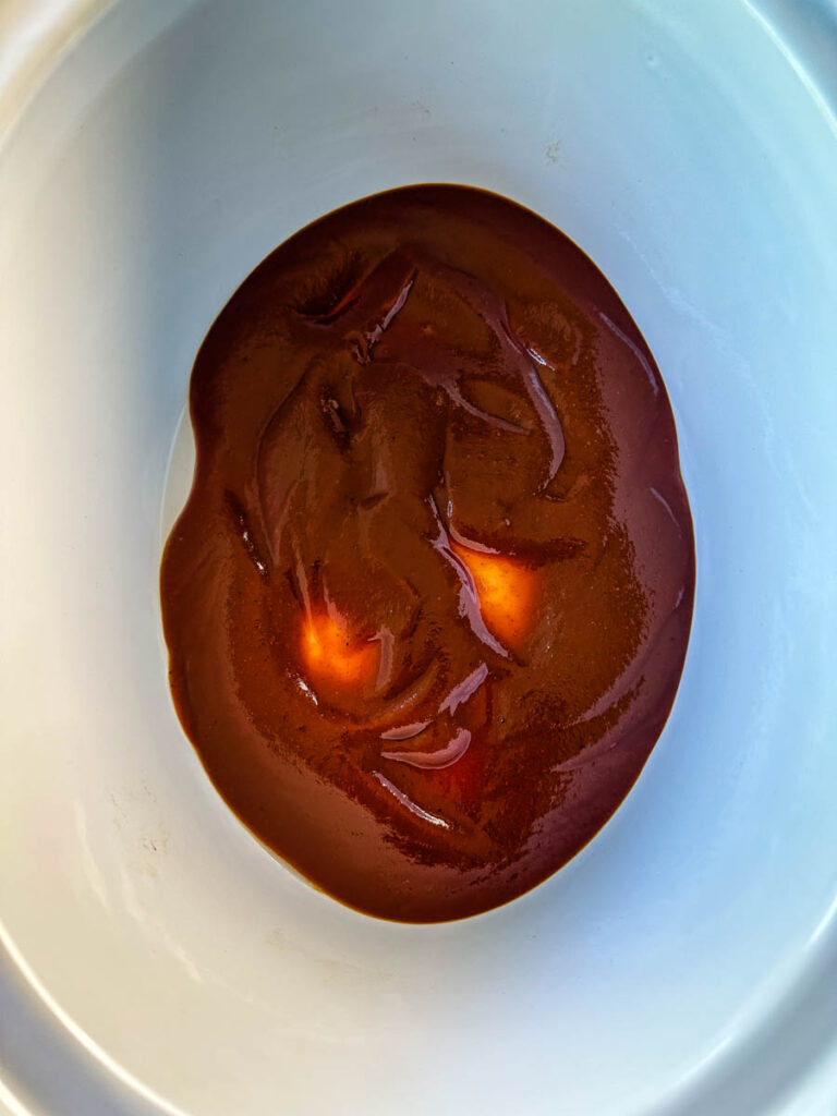 BBQ sauce in a white slow cooker Crockpot