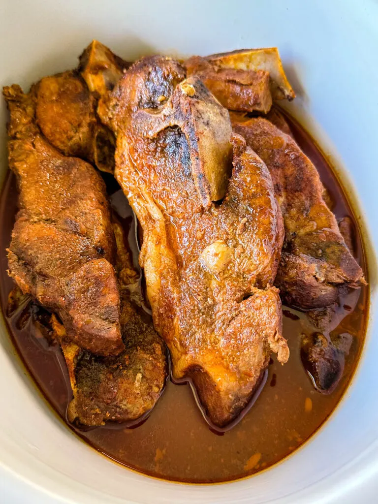 country style ribs with BBQ sauce in a slow cooker Crockpot